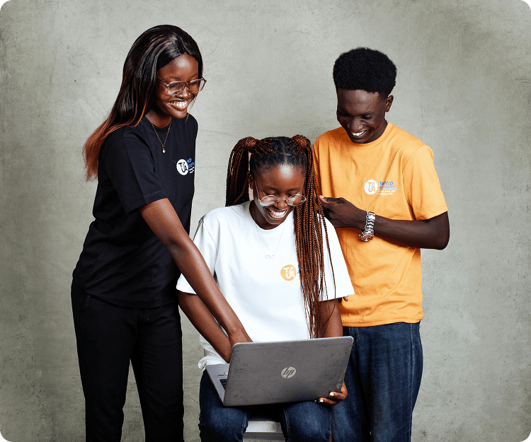 Scholarship applicants collaborating on a laptop